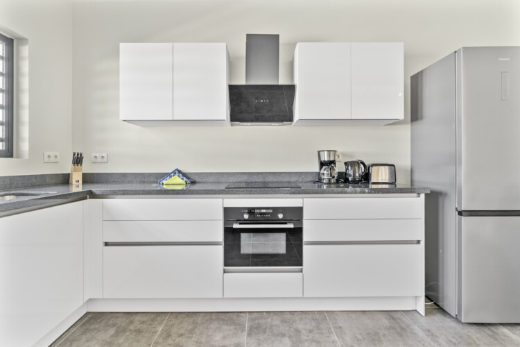 Modern kitchen with built-in appliances at Villa Blenchi Curaçao near Mambo Beach