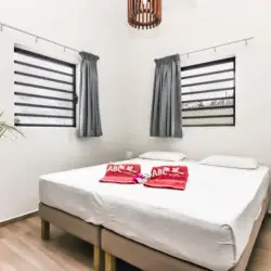 Bright bedroom with king-size bed at vacation rental in Curaçao – BookCuracao.com