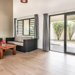 Bright living room with modern seating area at vacation rental in Curaçao – BookCuracao.com