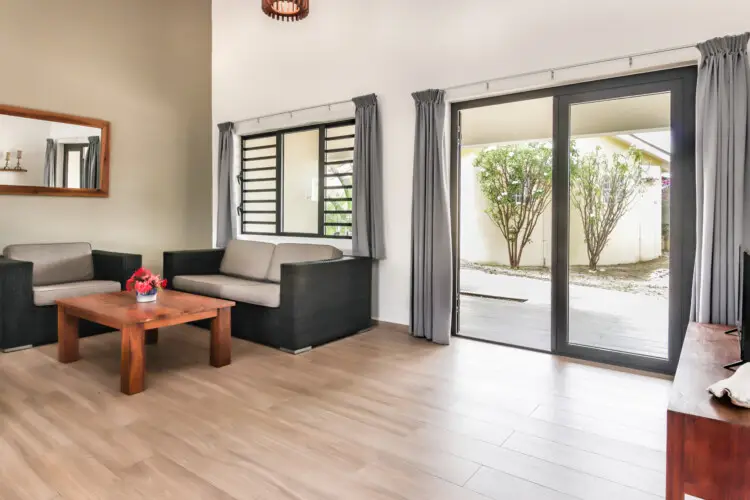 Bright living room with modern seating area at vacation rental in Curaçao – BookCuracao.com